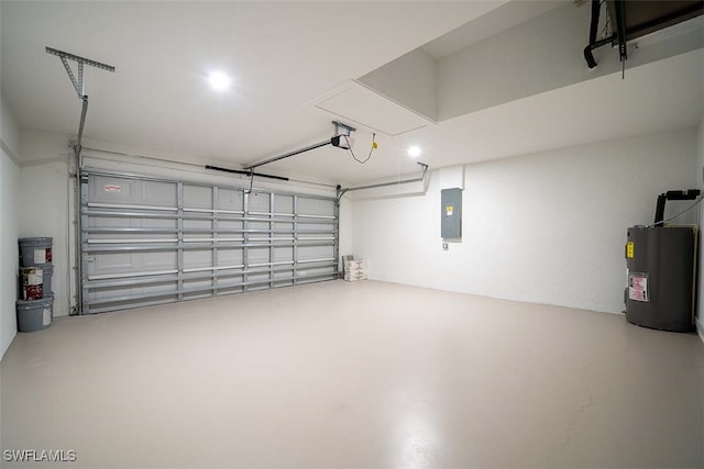 garage featuring electric panel and water heater