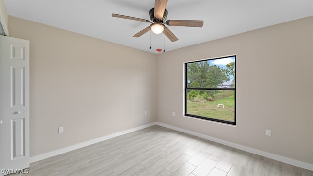 unfurnished room with light hardwood / wood-style floors and ceiling fan