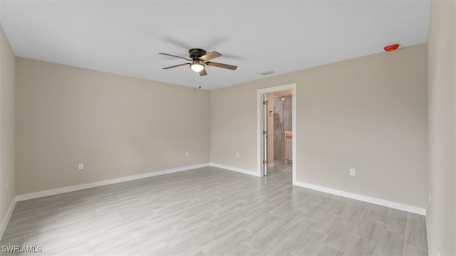 empty room featuring light hardwood / wood-style floors and ceiling fan