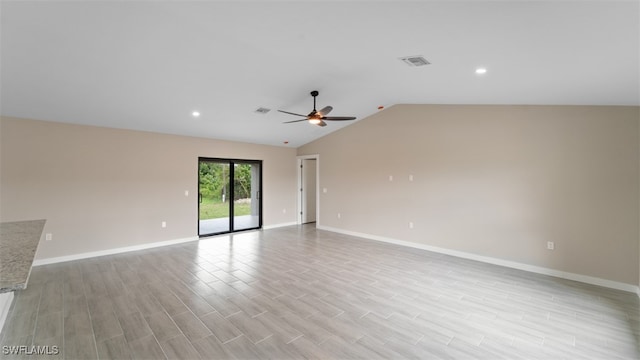 unfurnished room featuring ceiling fan, light hardwood / wood-style flooring, and vaulted ceiling