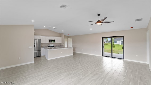 unfurnished living room with light hardwood / wood-style floors, ceiling fan, and lofted ceiling