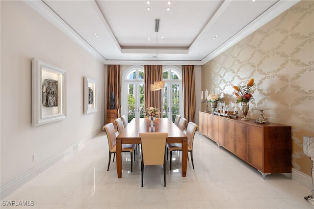 dining space featuring light tile patterned floors, a tray ceiling, and french doors