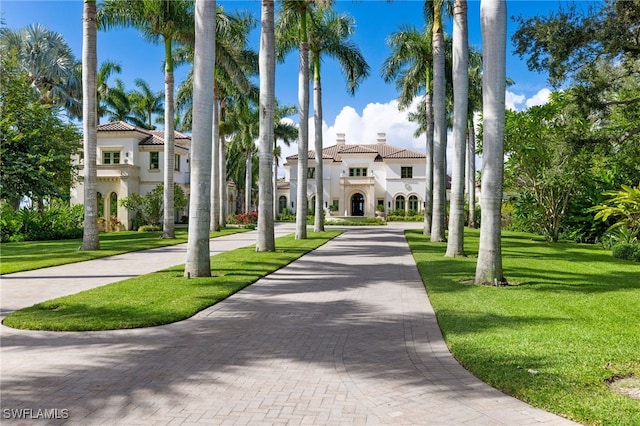 view of property's community with a lawn