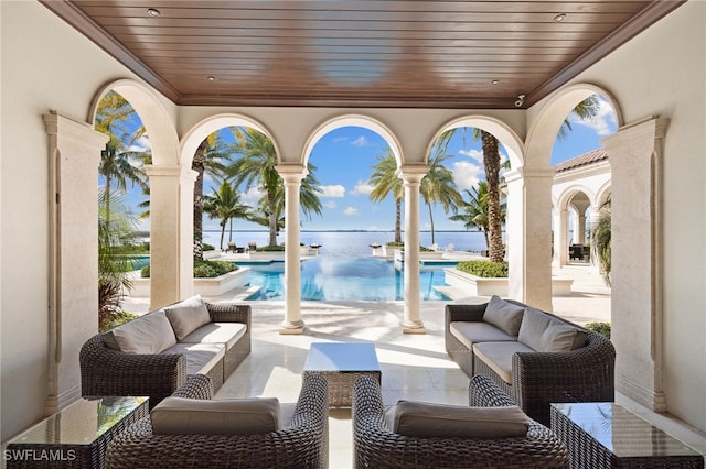 view of patio / terrace featuring an outdoor living space and a water view