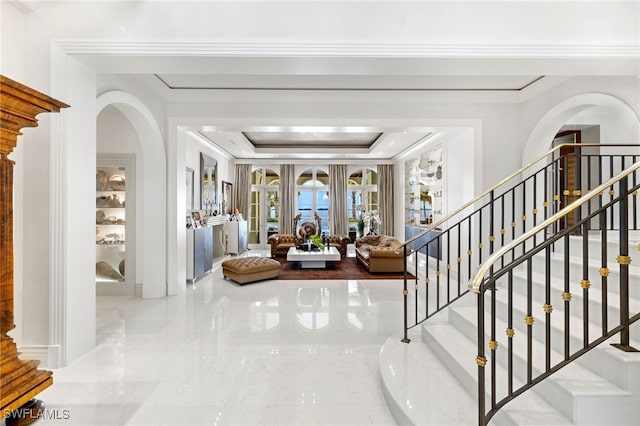 entrance foyer with a tray ceiling