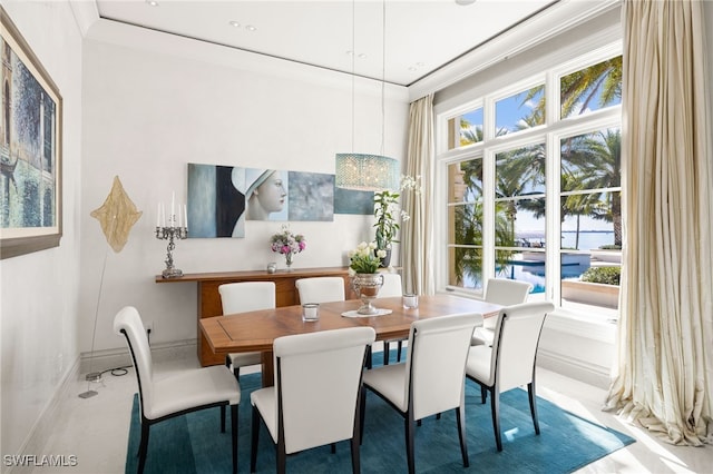 dining room featuring ornamental molding