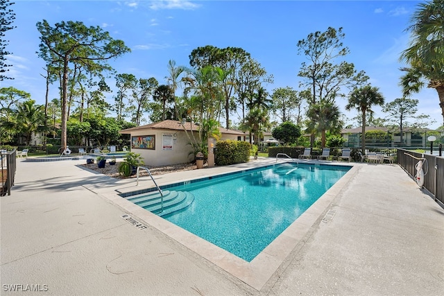 view of swimming pool with a patio area