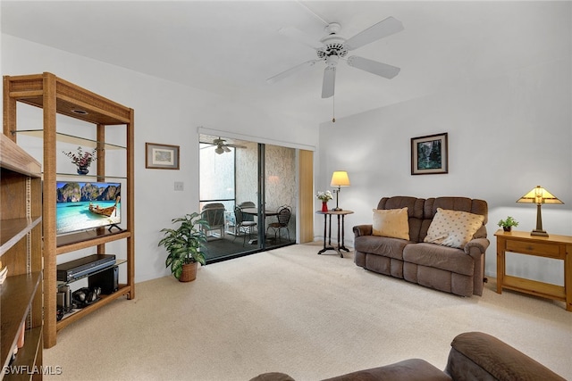 carpeted living room with ceiling fan