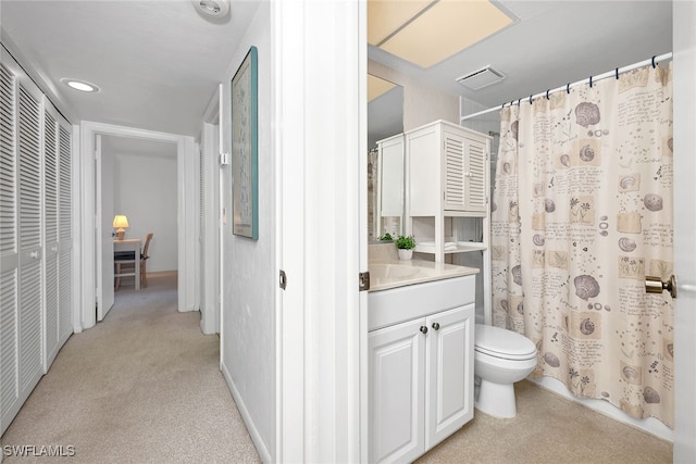 bathroom with vanity, toilet, and walk in shower