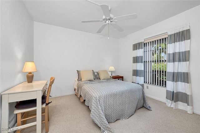 bedroom featuring ceiling fan and light colored carpet