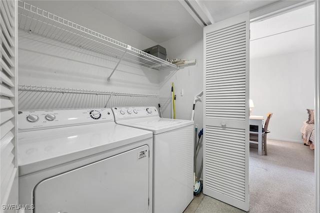 laundry room featuring washer and clothes dryer