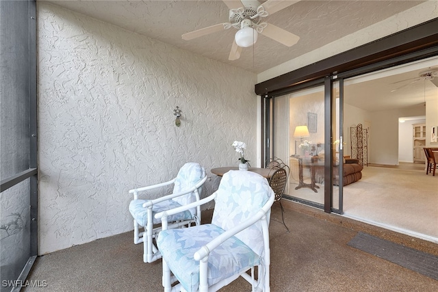 exterior space featuring ceiling fan