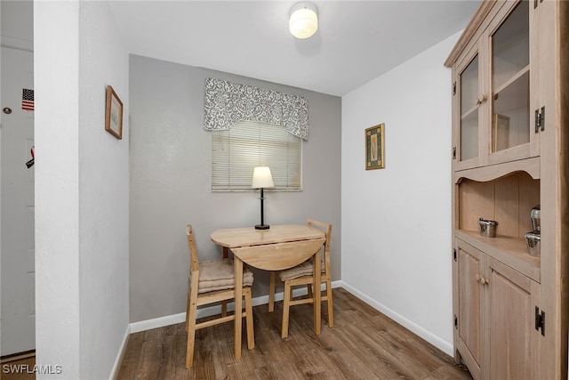 dining area with wood-type flooring