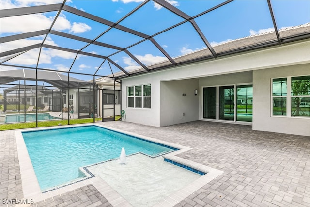 view of pool featuring a patio area and a lanai