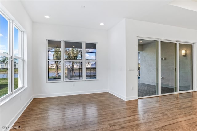 spare room with hardwood / wood-style flooring