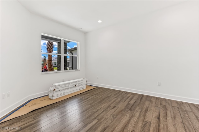 empty room featuring wood-type flooring