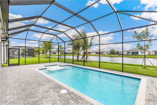 view of swimming pool with a lanai, a patio area, a water view, and a lawn