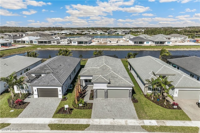 birds eye view of property featuring a water view