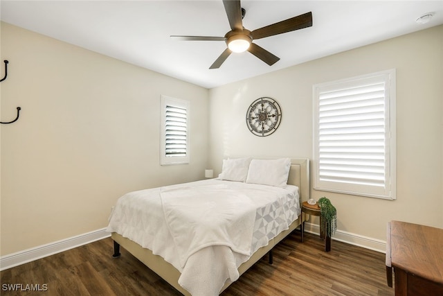 bedroom featuring ceiling fan and dark wood-type flooring