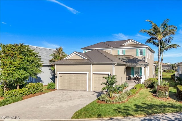 view of front of house featuring a garage and a front yard