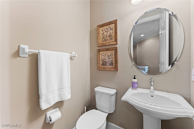 bathroom featuring sink and toilet