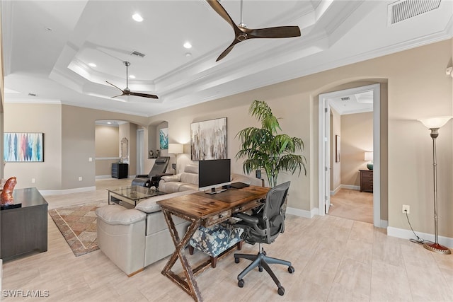 office with ceiling fan, a raised ceiling, and ornamental molding