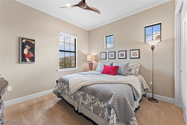 carpeted bedroom featuring ceiling fan, crown molding, and multiple windows