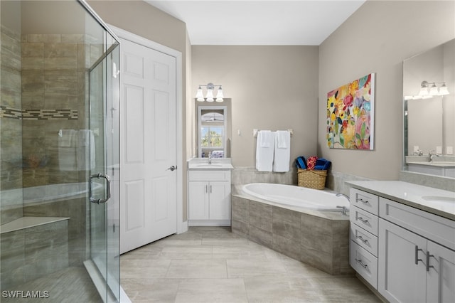 bathroom featuring vanity, tile patterned floors, and independent shower and bath