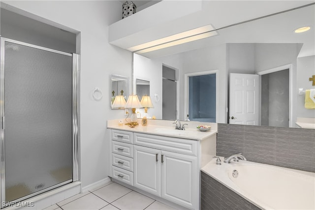 bathroom with tile patterned floors, vanity, and plus walk in shower