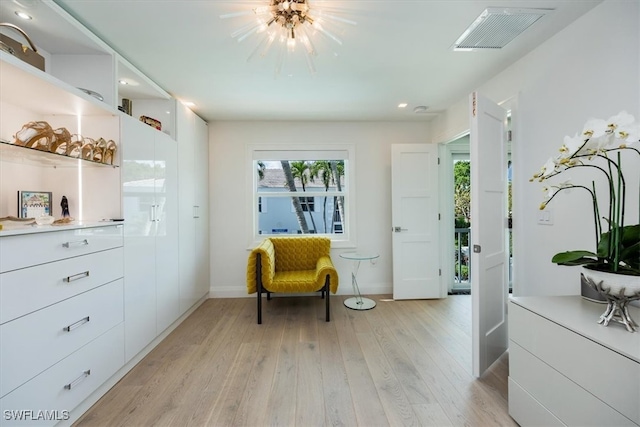 sitting room featuring light wood-type flooring