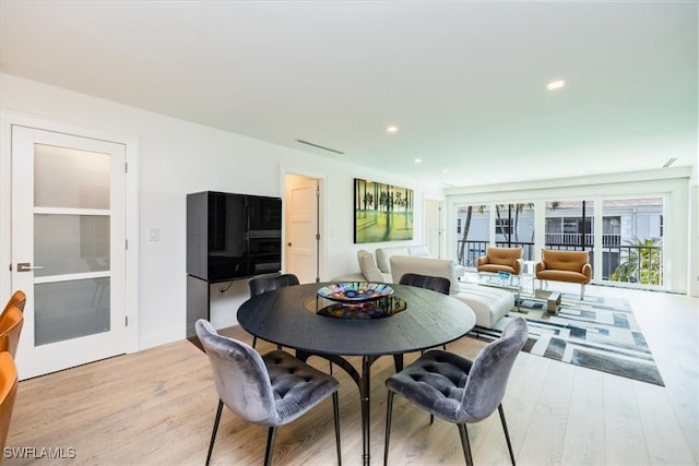 dining room featuring light wood-type flooring