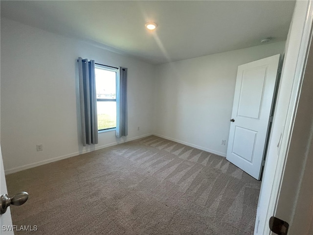 spare room with carpet floors