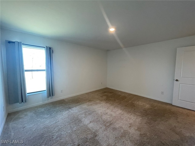 unfurnished room featuring carpet floors