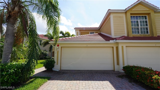 view of front of property with a garage