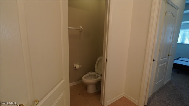 bathroom with tile patterned floors and toilet