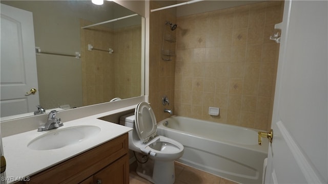 full bathroom with tile patterned floors, toilet, vanity, and tiled shower / bath