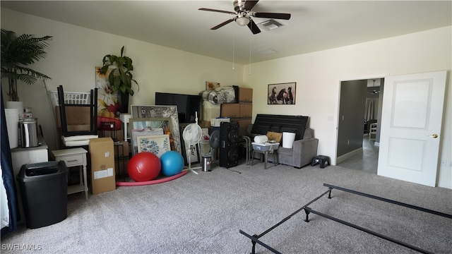 exercise room with carpet floors and ceiling fan