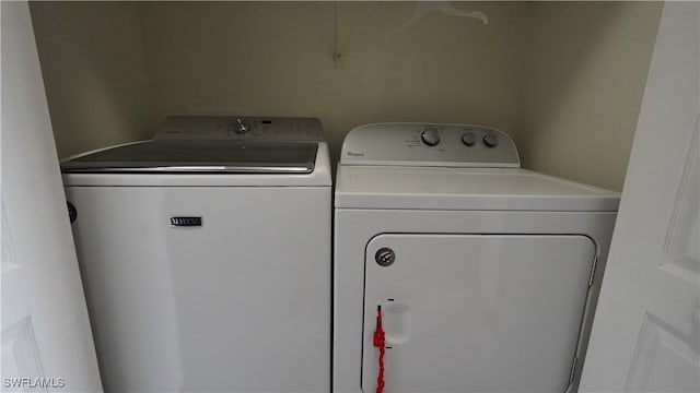 washroom with independent washer and dryer