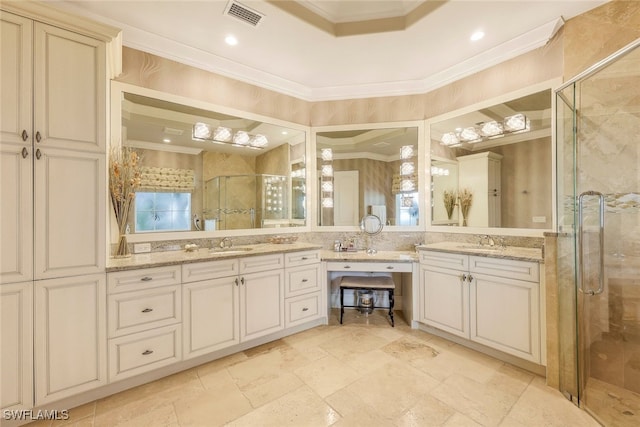 bathroom with crown molding, a shower with door, and vanity