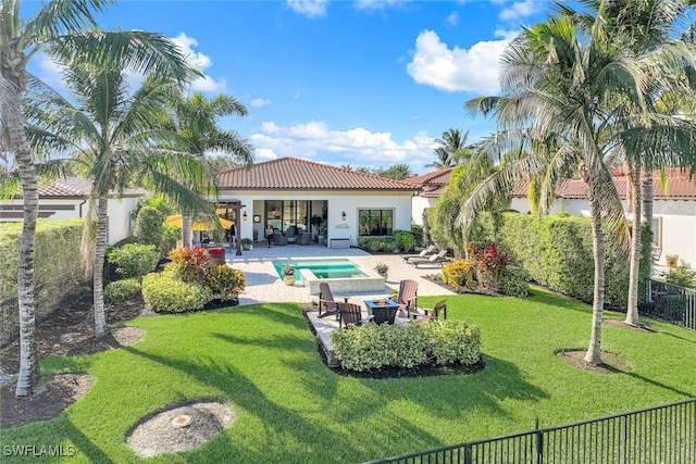 back of house with a yard, a patio, a fenced in pool, and an outdoor living space