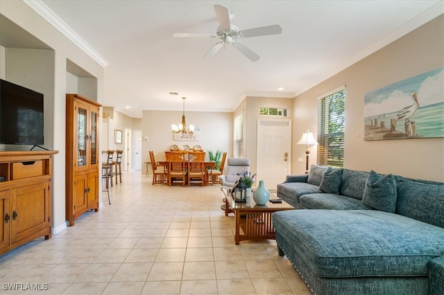 tiled living room with ceiling fan with notable chandelier and crown molding