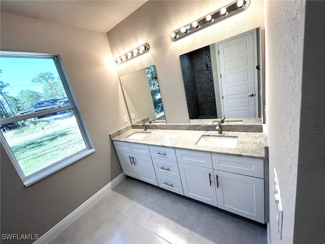 bathroom with tile patterned floors and vanity