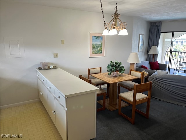 dining area featuring a chandelier