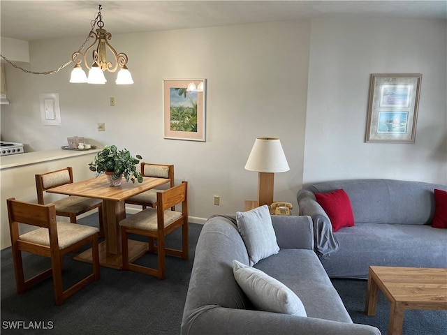 carpeted dining space featuring a chandelier