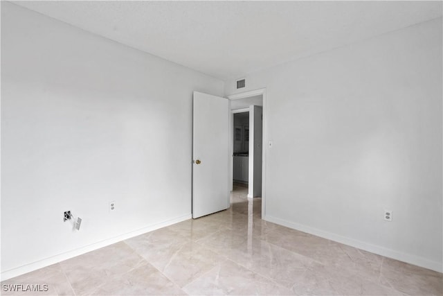 5260 Cedarbend Dr SW Unit 4, Fort Myers, FL 33919 - spare room with light marble finish flooring and baseboards