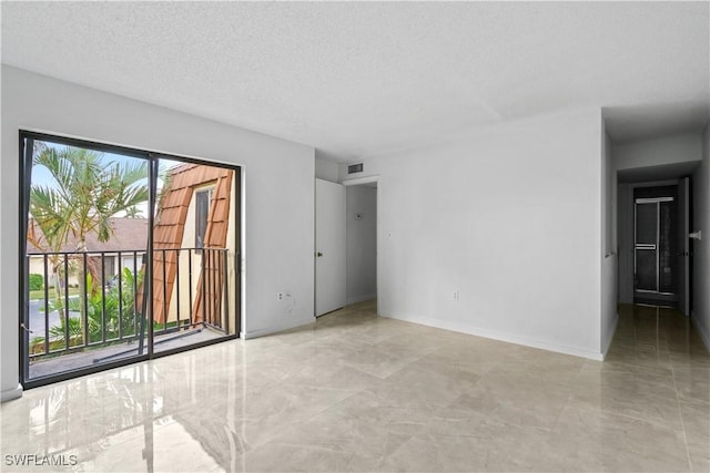 5260 Cedarbend Dr SW Unit 4, Fort Myers, FL 33919 - spare room featuring a textured ceiling and baseboards