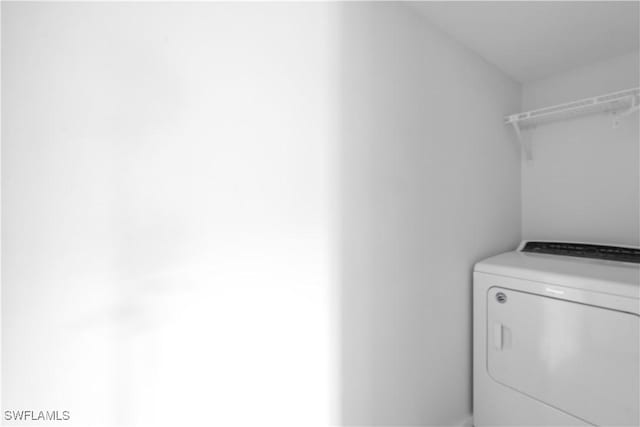 laundry room featuring washer / dryer