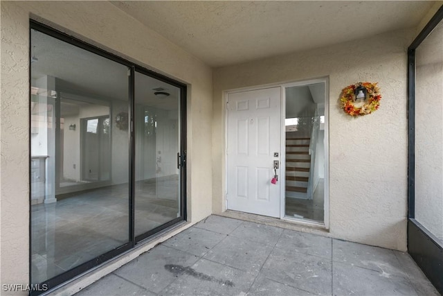 5260 Cedarbend Dr SW Unit 4, Fort Myers, FL 33919 - doorway to property featuring stucco siding