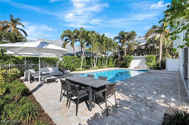 view of swimming pool featuring an outdoor living space and a patio