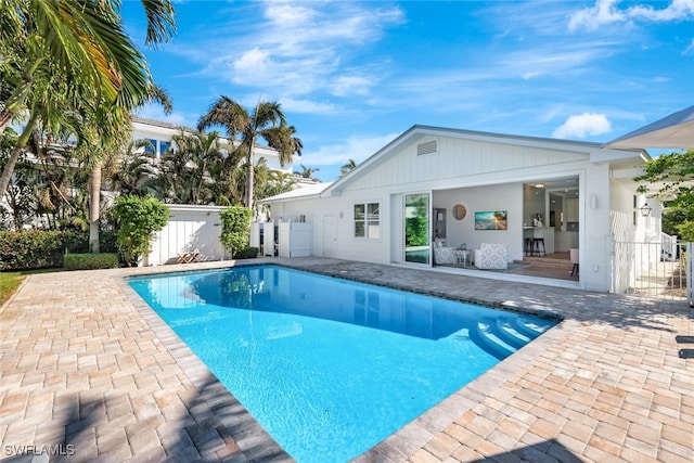 view of swimming pool with a patio